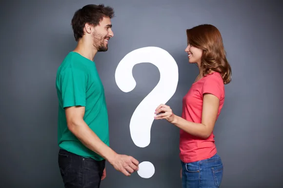 man and woman have a question mark in between them